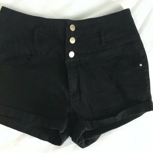 Black jean shorts with gold accents